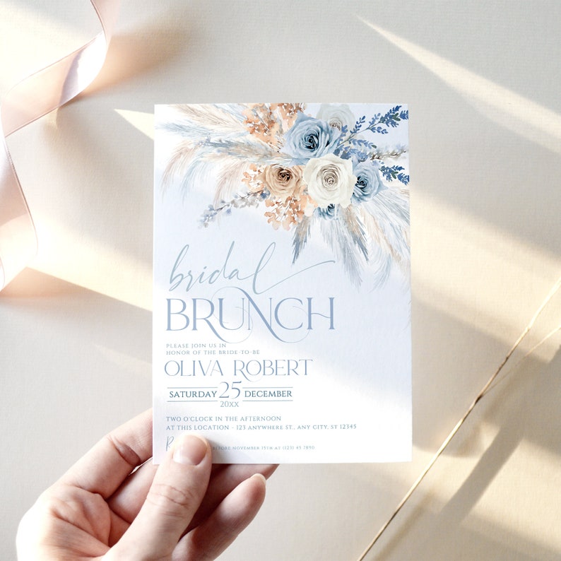 May include: A blue and white bridal brunch invitation with a watercolor floral design. The invitation reads "bridal brunch" and includes the bride's name, the date, and the time and location of the event.