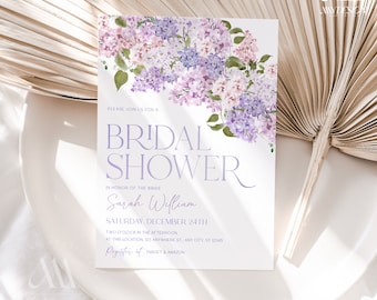 May include: A purple and white floral bridal shower invitation with the text "Please join us for a Bridal Shower in honor of the bride Sarah William Saturday, December 24th Two o'clock in the afternoon at this location 123 Anywhere St, Any City, ST 12345 Register at Target & Amazon"