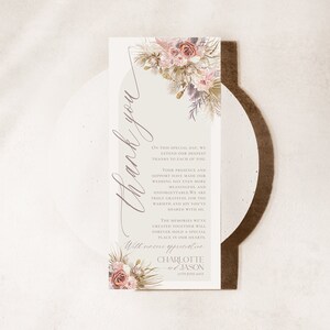 May include: A thank you card with a floral design and the text "Thank you" in a script font. The card also includes the text "On this special day, we extend our deepest thanks to each of you. Your presence and support have made our wedding day even more unforgettable. We are truly grateful for the warmth and joy you've shared with us. The memories we've created together will forever hold a special place in our hearts. With sincere appreciation, Charlotte & Jason, September 2023."