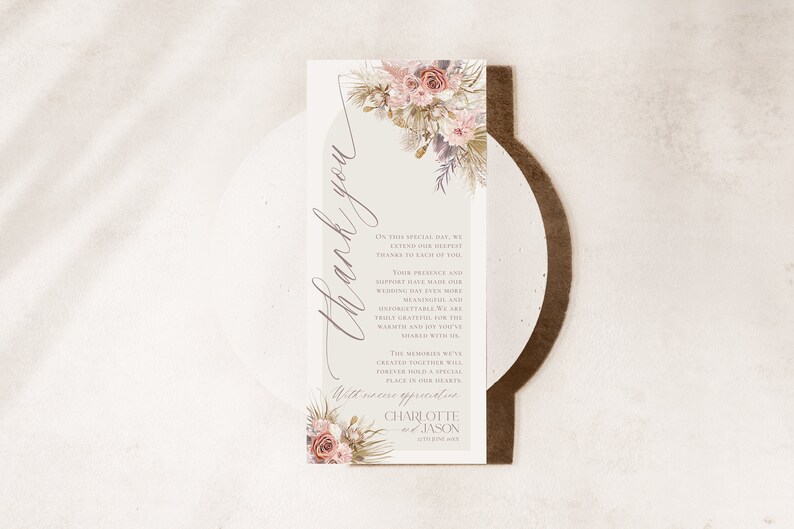 May include: A thank you card with a floral design and the text "Thank you" in a script font. The card also includes the text "On this special day, we extend our deepest thanks to each of you. Your presence and support have made our wedding day even more unforgettable. We are truly grateful for the warmth and joy you've shared with us. The memories we've created together will forever hold a special place in our hearts. With sincere appreciation, Charlotte & Jason, September 2023."