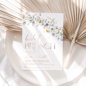 May include: A floral-themed bridal brunch invitation with a rose gold font. The invitation features the text "bridal brunch" and the bride-to-be's name, "Liam Smith". The invitation also includes the date, time, and location of the event. RSVP information is included at the bottom of the invitation.