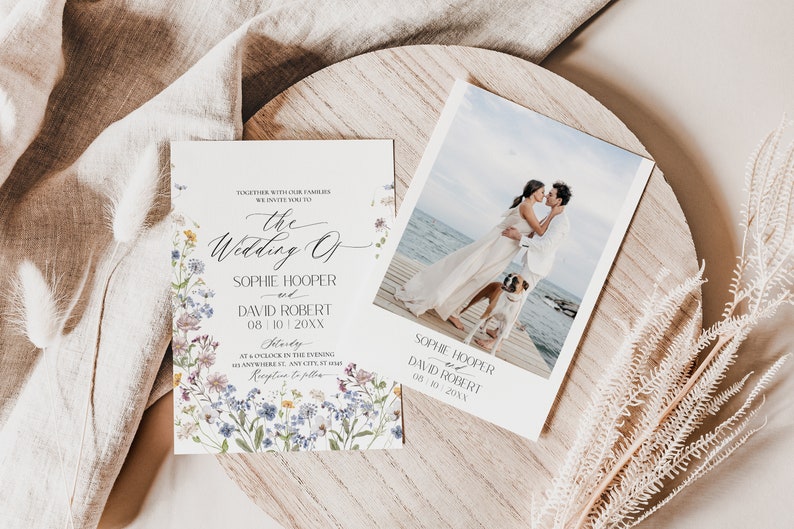 May include: A wedding invitation with a floral design and a photo of a couple on a beach. The invitation text reads "The Wedding of Sophie Hooper and David Robert 08 10 20XX Saturday at 6 o'clock in the evening anywhere in the city, st. hans Reception to follow"