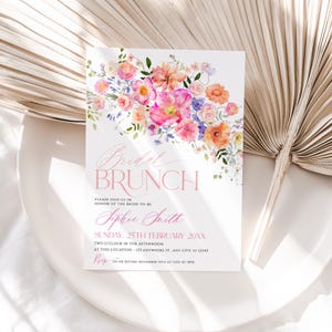 May include: A white rectangular invitation card featuring a watercolor floral arrangement in shades of pink, orange, and purple at the top. The text reads Bridal BRUNCH, PLEASE JOIN US IN HONOR OF THE BRIDE-TO-BE, Sophie Smith, SUNDAY, 25TH FEBRUARY 20XX.