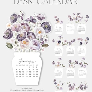 May include: A desk calendar featuring watercolor illustrations of violet poppies. The calendar includes a January 2026 page and individual month pages with floral arrangements. Available in multiple sizes: 10cm x 15cm, 14cm x 21cm, and 18cm x 27cm.