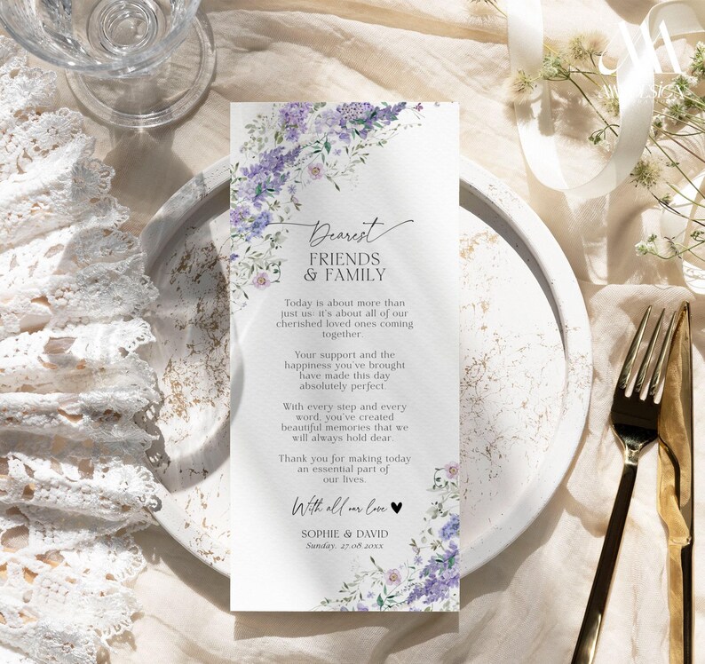 May include: A rectangular wedding program card featuring a watercolor floral border of purple lilacs and green leaves. The text reads Dearest Friends & Family, followed by a thank you message, the names Sophie & David, and the date Sunday, 27.08.20xx.