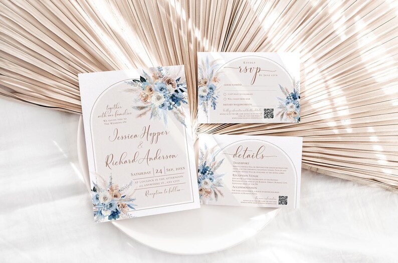 May include: A wedding invitation suite featuring a main invitation, an RSVP card, and a details card. Each white card displays a beige arch, blue and tan floral illustrations, and elegant script text including names Jessica Hopper and Richard Anderson.