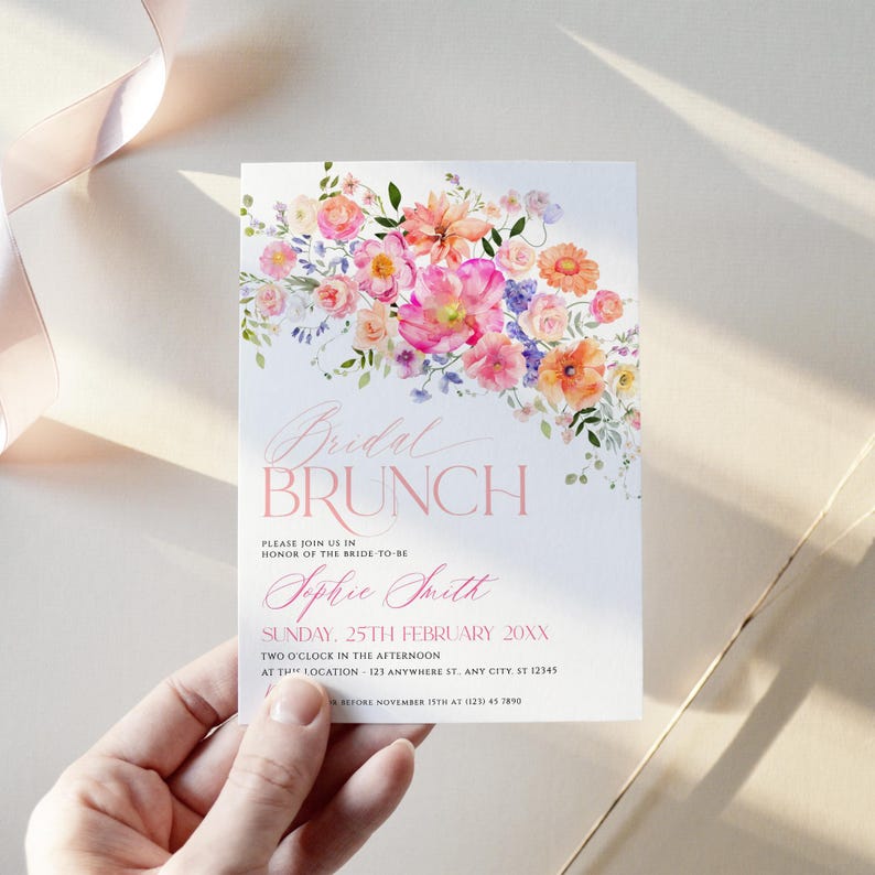 May include: A white rectangular invitation card featuring a watercolor floral arrangement in shades of pink, orange, and purple at the top. The text reads Bridal BRUNCH, PLEASE JOIN US IN HONOR OF THE BRIDE-TO-BE, Sophie Smith, SUNDAY, 25TH FEBRUARY 20XX.