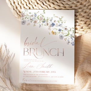 May include: A white invitation with a floral border in shades of blue and pink. The text reads "bridal brunch" in rose gold lettering. The invitation is for a bridal brunch for Liam Smith on Sunday, 25th February 20XX at 2:00 PM. The RSVP information is included at the bottom.