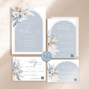 May include: A wedding invitation suite with a blue and white color scheme. The invitation features a watercolor illustration of pampas grass and flowers. The text on the invitation reads "The Wedding of Jessica Hooper and Richard Anderson, Saturday, 24 September 20XX".