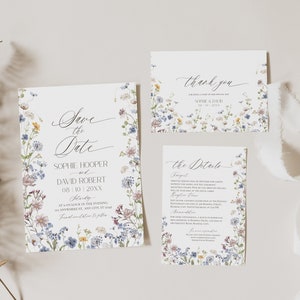 May include: A wedding stationery set featuring a Save the Date card, a thank you card, and a details card, all decorated with a colorful wildflower border. The text includes Save the Date, Sophie Hooper and David Robert, thank you, and the details.
