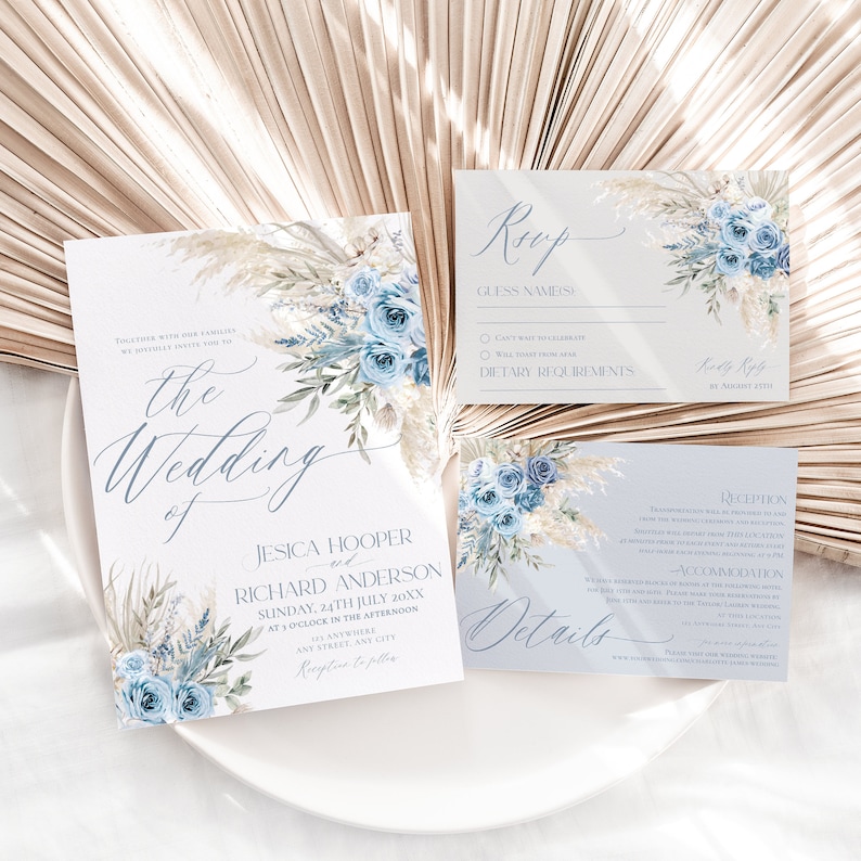 May include: A wedding invitation suite with a blue and white floral design. The invitation features the text "The Wedding of Jesica Hooper and Richard Anderson" with the date and time of the wedding. The RSVP card includes a section for guests to provide their names and dietary requirements. The details card includes information about the reception and accommodation.