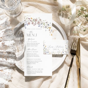 May include: A wedding menu card with floral designs and the text "the MENU" in a decorative font. The menu includes appetizers, main course, and dessert options. The card also includes a place card with the text "Lucar Anderson TABLE 01" and floral designs.