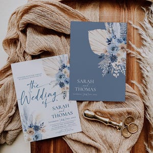 May include: Two wedding invitations with blue and white floral designs. The text on the invitations reads "The Wedding of Sarah and Thomas" and "Sarah and Thomas, Saturday 24 Sep, 20XX".