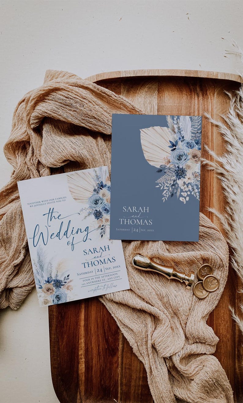 May include: Two wedding invitations with blue and white floral designs. The text on the invitations reads "The Wedding of Sarah and Thomas" and "Sarah and Thomas, Saturday 24 Sep, 20XX".