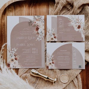 May include: A wedding invitation suite with a brown background and floral illustrations. The invitation includes the names "Jarred Ellis & Isabel Lowe" and the date "02.02.2022". The RSVP card includes a section for guests to indicate their attendance and dietary preferences. The details card includes information about transportation, reception venue, and accommodations.