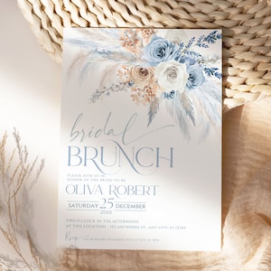 May include: A blue and white floral bridal brunch invitation with the text "bridal brunch" and "Olivia Robert" in a light blue font. The date is Saturday, December 25th, 20XX. The invitation includes the RSVP information.