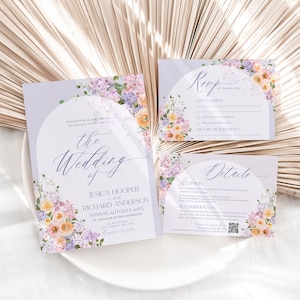 May include: Purple and white wedding invitation suite with floral designs. The invitation card features the text "the wedding of Jessica Hooper and Richard Anderson" with the date and time of the wedding. The RSVP card has a section for guest names, RSVP options, and dietary requirements. The details card includes information about the reception, location, and accommodation.