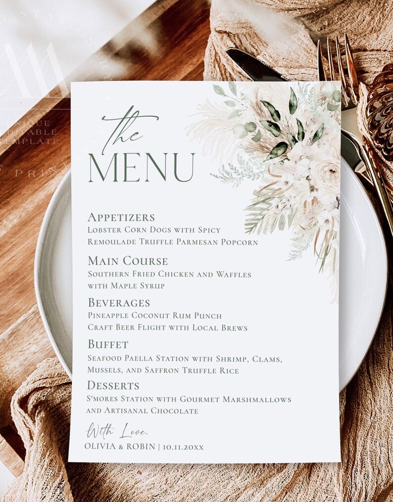 May include: A white rectangular menu card featuring dark green text and a floral illustration of pampas grass and white roses. The text lists appetizers, main course, beverages, buffet, and desserts, ending with Olivia & Robin 10.11.20XX.