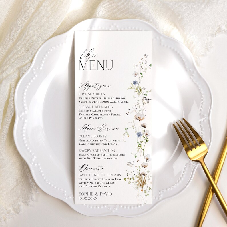 May include: A white menu card with a floral design and the text "the MENU" at the top. The menu lists appetizers, main course, and desserts. The text at the bottom of the card reads "SOPHIE & DAVID 10.08 20XX".