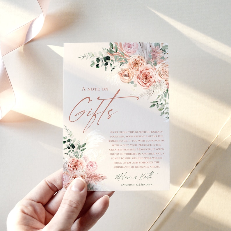 May include: A rectangular wedding gift registry card featuring a floral arrangement of peach roses and pampas grass. The text reads A NOTE ON GIFTS, followed by a poem about wishing wells, ending with the names Melissa & Keith and Saturday | 24 | Sep, 20XX.