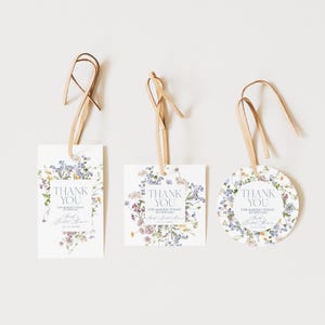 May include: Three different thank you tags with a floral design. The tags are square, round, and rectangular. The text on the tags reads "Thank You for making today so special".
