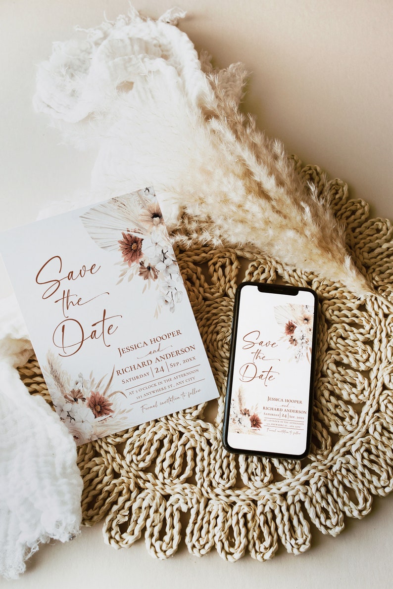 May include: A rectangular Save the Date card and a smartphone displaying the same design, featuring floral illustrations in muted tones and copper-colored text reading Jessica Hooper and Richard Anderson, Saturday 24 Sep, 20XX.