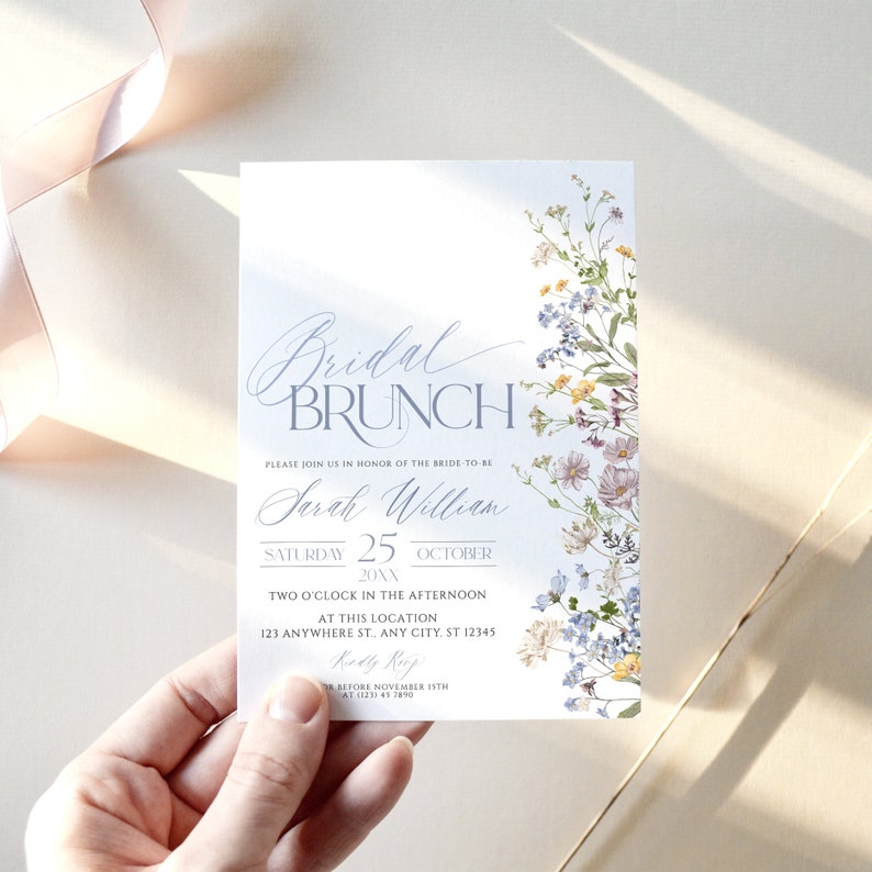May include: A blue and white bridal brunch invitation with a floral design. The invitation says "Bridal Brunch" and includes the bride-to-be's name, "Sarah William", the date, "Saturday 25 October 20XX", and the time, "Two o'clock in the afternoon". The invitation also includes the location, "123 Anywhere St., Any City, ST 12345", and the RSVP information, "Kindly RSVP before 15th November at (123) 45 7890".