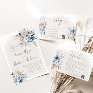 May include: A wedding invitation suite featuring a main invitation, an RSVP card, and a details card. Each piece displays an arched frame, floral illustrations in shades of blue and beige, and elegant script text for Jessica Hopper and Richard Anderson.
