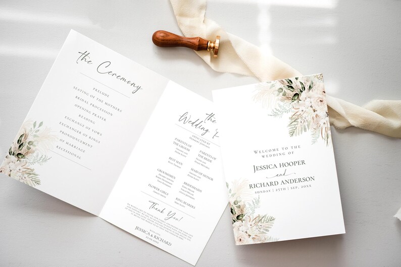 May include: A folded wedding program and a separate invitation card featuring floral illustrations in muted tones. The text includes the names Jessica Hooper and Richard Anderson, the date September 25th, 2023, and a ceremony outline. A wooden wax seal stamp rests nearby.