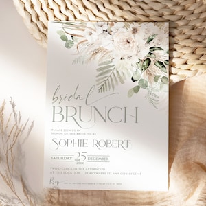 Puede incluir: Un diseño floral blanco y verde con el texto "bridal brunch" en gris. La invitación incluye el nombre de la novia, Sophie Robert, y la fecha del evento, sábado 25 de diciembre. La información de RSVP se incluye en la parte inferior de la invitación.