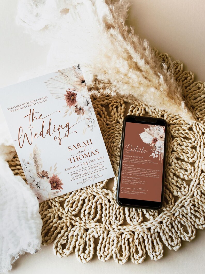 May include: A wedding invitation card and a smartphone displaying event details. The card features floral illustrations, the text 'The Wedding of Sarah and Thomas', and date information. The phone screen shows matching floral graphics and text.