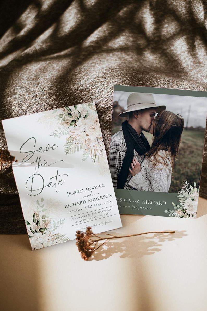 May include: Save the date card with a watercolor floral design and a photo of a couple kissing. The card says "Save the Date" in a script font and includes the names Jessica Hooper and Richard Anderson, the date September 24th, and the time 3 o'clock in the afternoon.