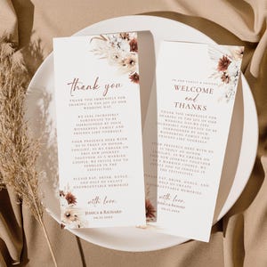 May include: Two rectangular wedding thank you cards with white backgrounds and floral accents in shades of brown, cream, and rust. The text includes "thank you," "welcome and thanks," and the names "Jessica & Richard" with the date "09.25.20XX."