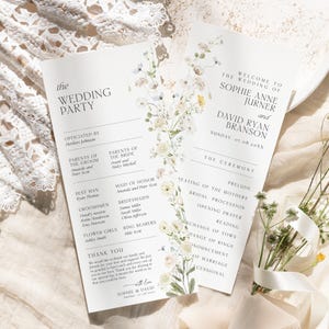May include: Elegant wedding programs with floral accents. The programs feature the text "The Wedding Party" and "Welcome to the Wedding of Sophie Anne Jurner and David Ryan Branson". The design includes delicate flowers.