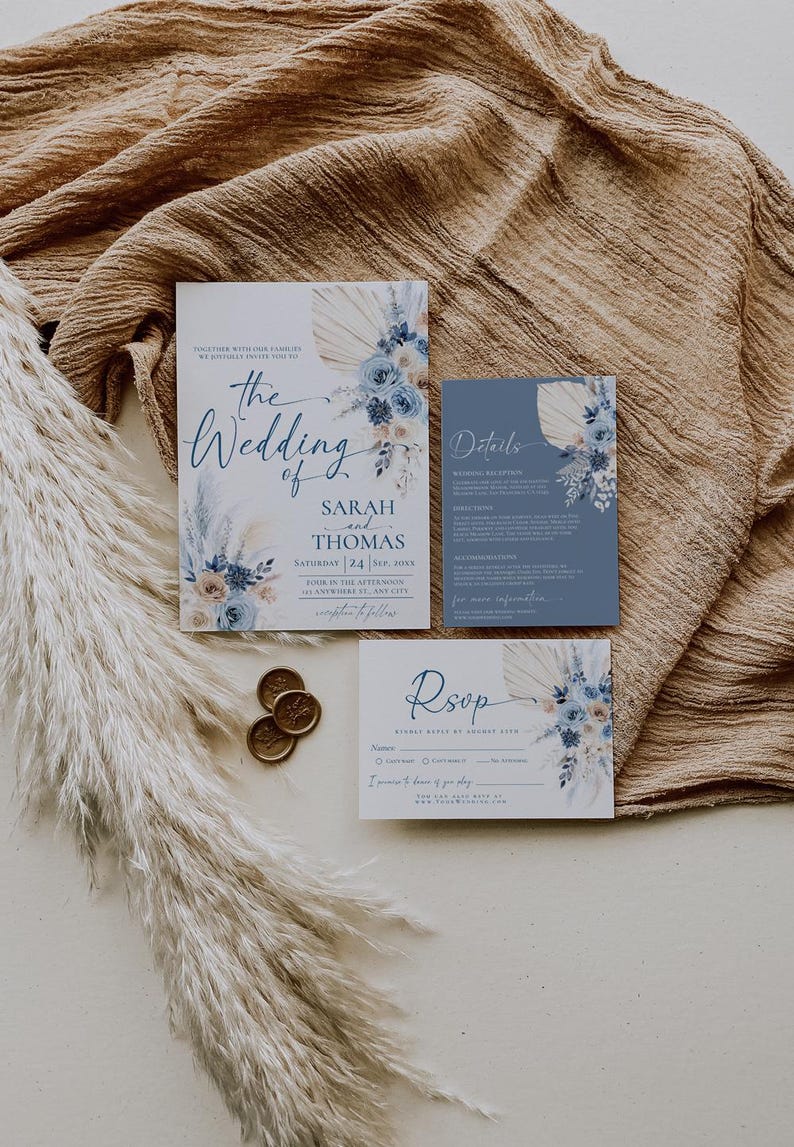 May include: Wedding invitation suite with a blue and white floral design. The invitation features the text "The Wedding of Sarah and Thomas" with the date "Saturday 24 Sep 20XX". The RSVP card includes the text "Rsop" and a space for guests to RSVP by August 20XX.