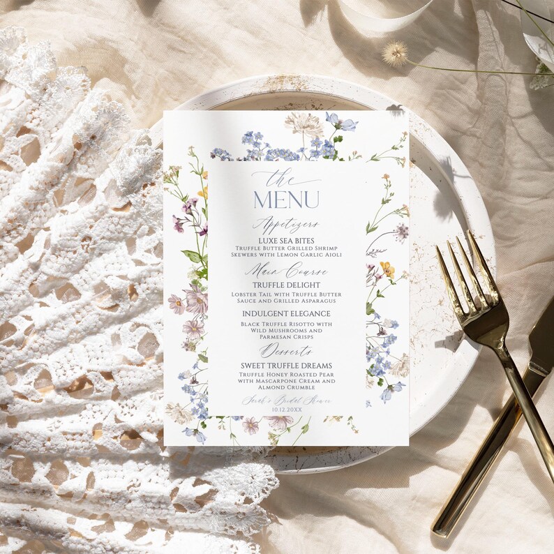 Puede incluir: Una tarjeta de men&uacute; rectangular con un delicado borde floral de acuarela en tonos azules, amarillos y rosas. El texto dice: THE MENU, Appetizers, LUXE SEA BITES, TRUFFLE BUTTER GRILLED SHRIMP SKEWERS WITH LEMON GARLIC AIOLI, Main Course, TRUFFLE DELIGHT, LOBSTER TAIL WITH TRUFFLE BUTTER SAUCE AND GRILLED ASPARAGUS, INDULGENT ELEGANCE, BLACK TRUFFLE RISOTTO WITH WILD MUSHROOMS AND PARMESAN CRISPS, Desserts, SWEET TRUFFLE DREAMS, TRUFFLE HONEY ROASTED PEAR WITH MASCARPONE CREAM AND ALMOND CRUMBLE, Sarah's Bridal Shower, 10.12.20XX.