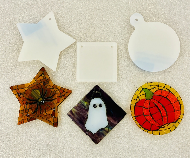 May include: A set of ten blank, white, ceramic ornaments in various shapes, including a star, a circle, a square, and a pumpkin. The ornaments are ready to be painted or decorated.