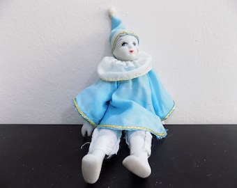 small porcelain clown dolls
