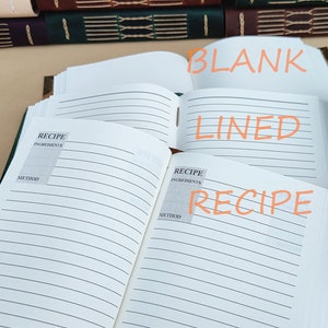 May include: Open recipe journals with lined pages and a blank page. The journals have a leather-like cover and are open to display the interior pages. The words "RECIPE", "LINED", and "BLANK" are written on the pages.