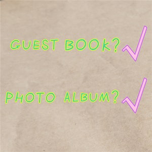May include: A brown paper background with the text "GUEST BOOK?" and "PHOTO ALBUM?" written in green. A pink checkmark is next to each question.