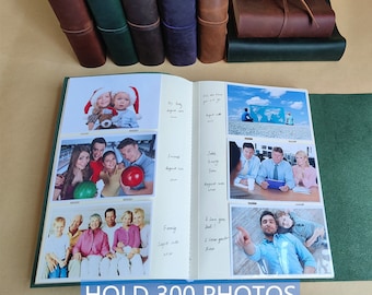 May include: A green leather photo album with a white interior. The album is open to reveal several photos of people and handwritten captions. The album is labeled "HOLD 300 PHOTOS".