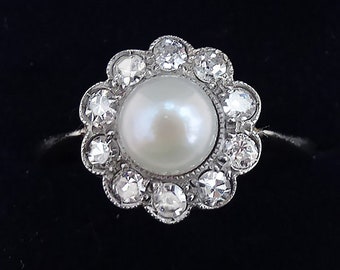 Beautiful art deco platinum 0.30ct diamond and pearl vintage antique daisy ring