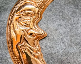 Vintage copper crescent moon face copper mold decor.
