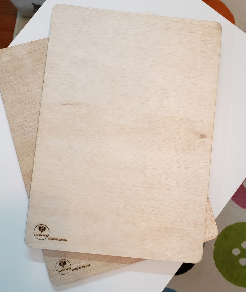 May include: Two wooden cutting boards with a heart logo and the text "Love the Earth" and "Made in the USA".