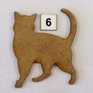 May include: Three wooden cat cutouts, each with a different pose. The cat cutouts are brown and have a natural wood finish. The cutouts are numbered 5, 6, and 7.