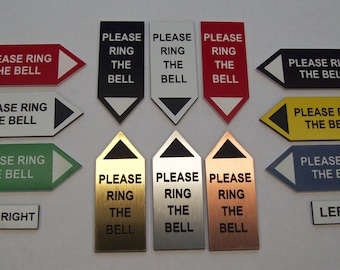 May include: A collection of 12 different door signs that say "Please Ring The Bell" in black text on various coloured backgrounds. The signs are in different shapes and sizes, including arrows, rectangles, and triangles. The signs are made of different materials, including metal, plastic, and wood.