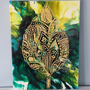 May include: Abstract painting on canvas featuring a gold leaf design on a green and yellow background.