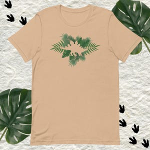 Dinosaur Jungle T-Shirt – Tropical Stegosaurus Shirt for Kids or Adults – Prehistoric Jungle Graphic Tee – Dino Lover Gift – Unisex Soft Tee