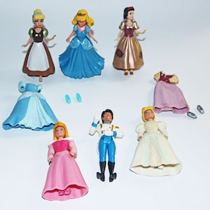 open lace back dress Disney Princess -- Royal Clips-Multipack with 7 Small Dolls Collection  Fashion Toy with Glittery 1-Clip Dresses, Frustration Free Packaging  (Amazon Exclusive) in Dubai - UAE main image 0