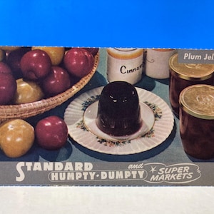 May include: A vintage postcard advertising Standard Humpty-Dumpty Super Markets. The postcard features a bowl of plums, two jars of plum jelly, and a dish of plum jelly with the text "Plum Jelly".
